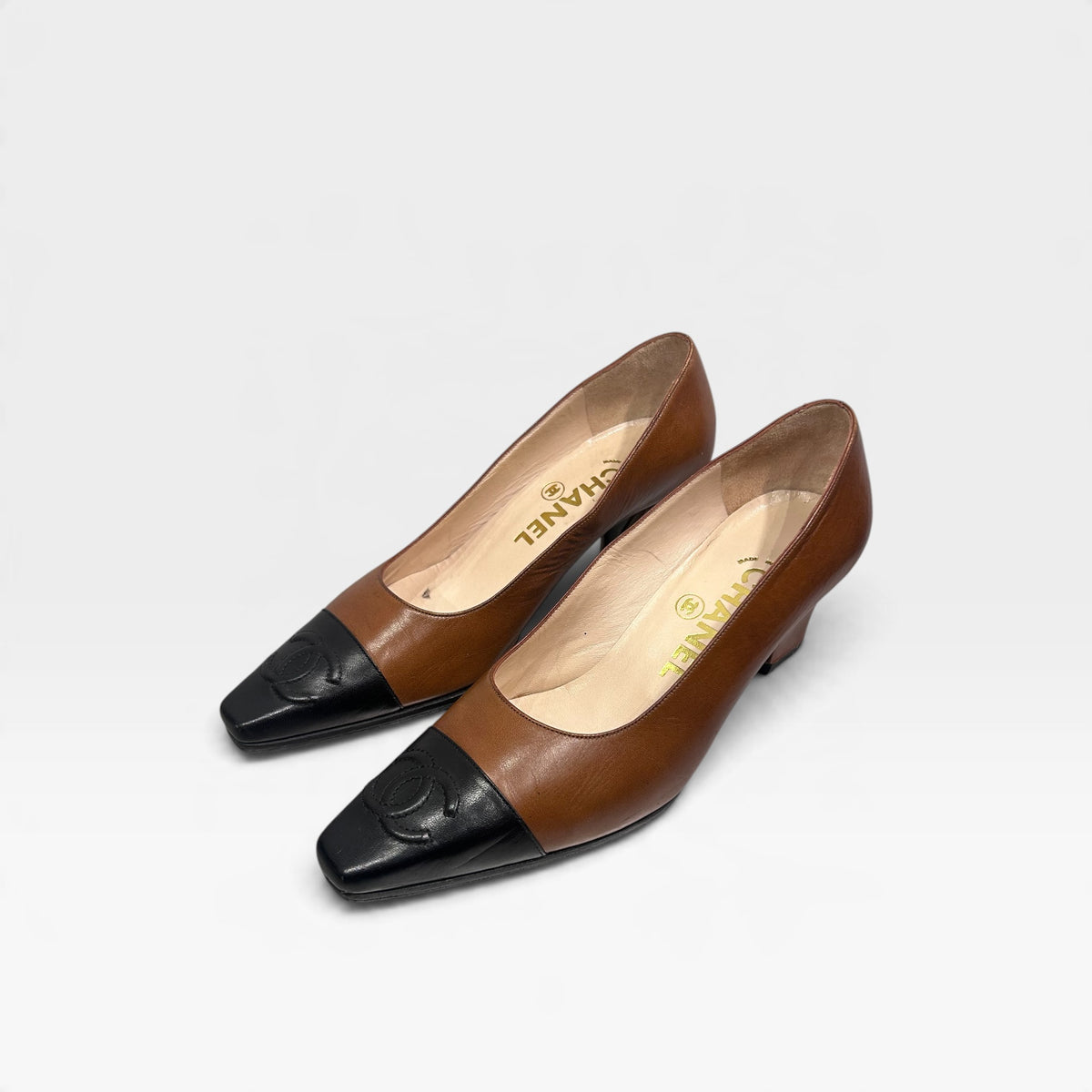 Vintage Chanel Brown & Black Leather Pumps | 1990s