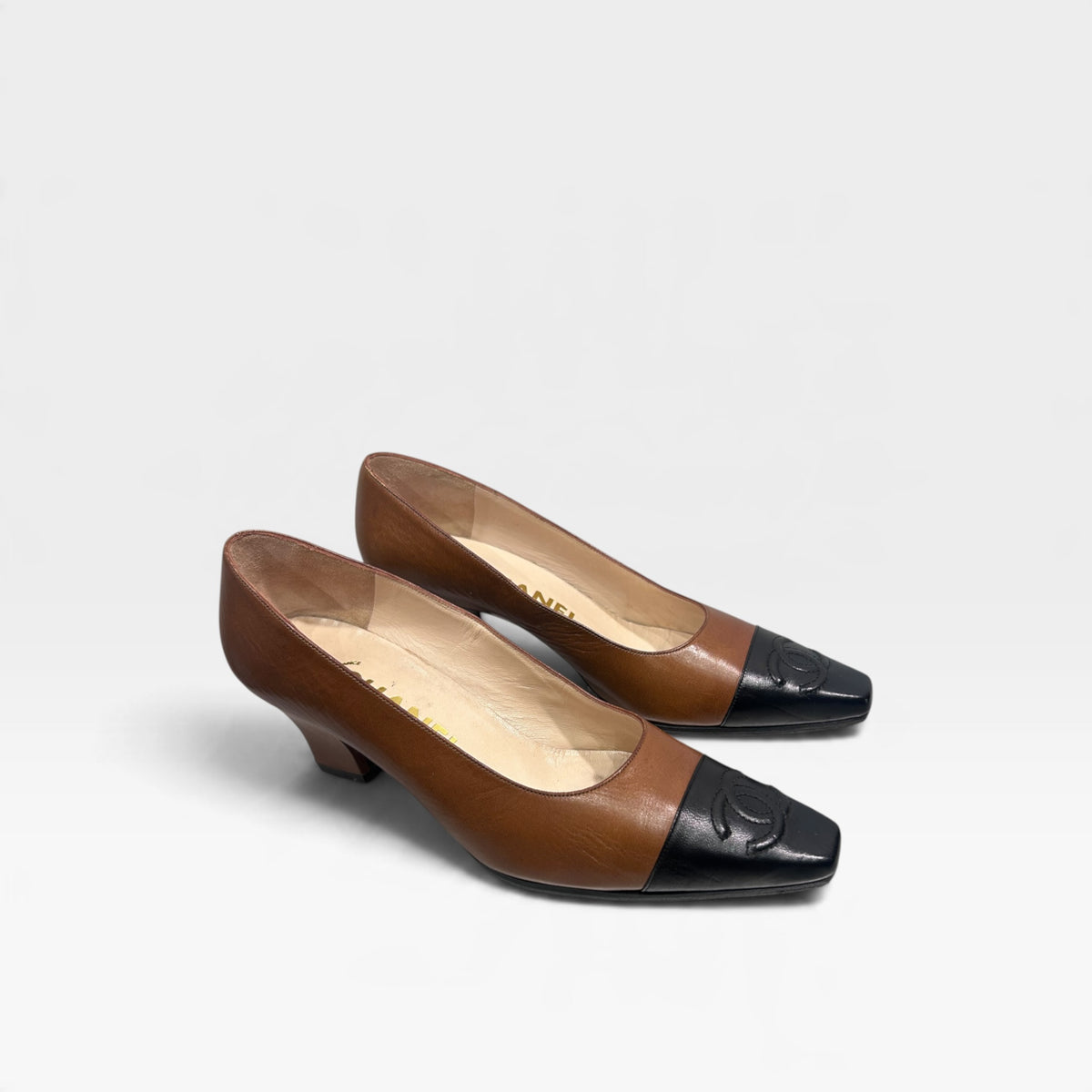 Vintage Chanel Brown & Black Leather Pumps | 1990s
